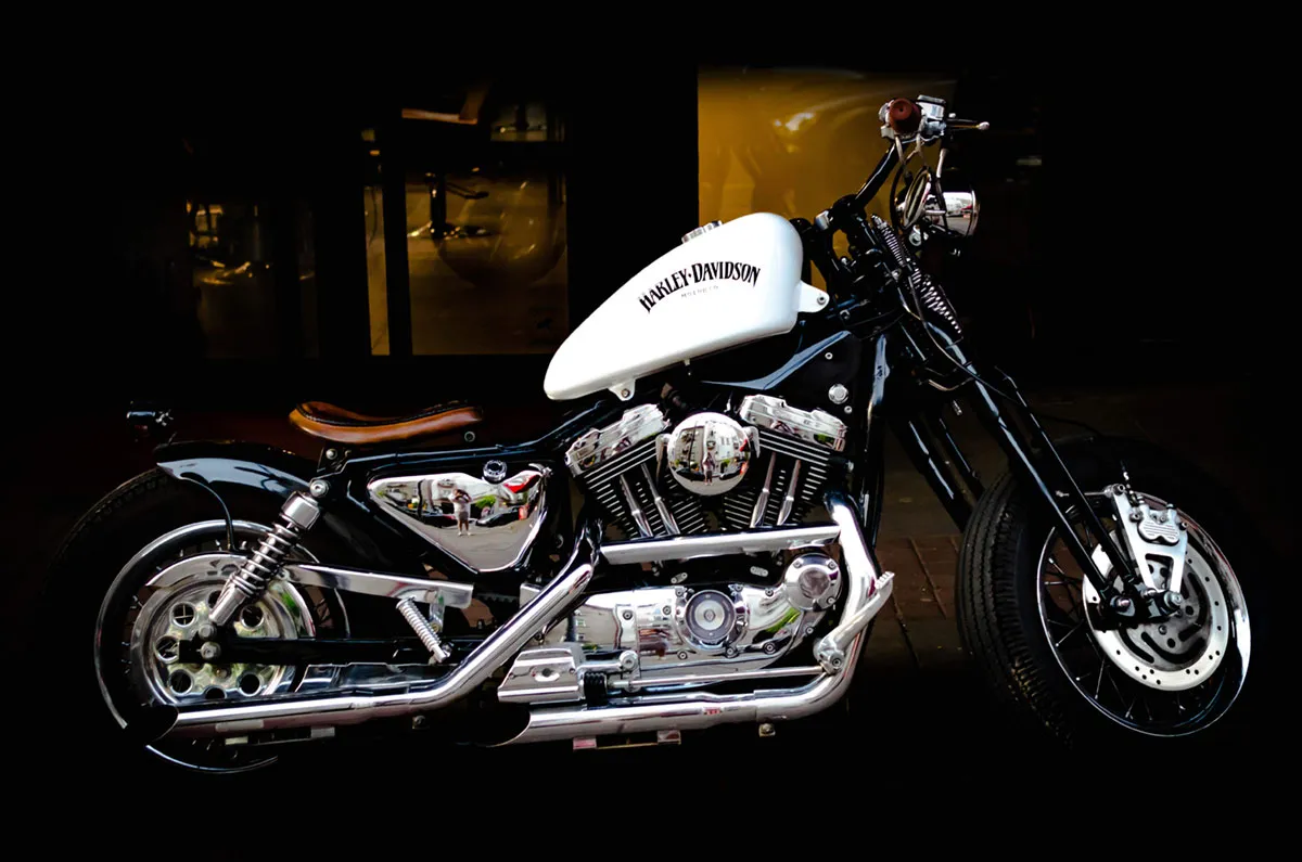 A cruiser motorcycle parked indoors